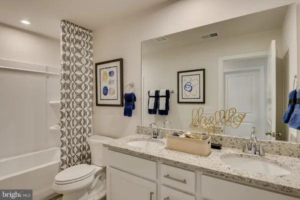 a bathroom with a shower and a sink