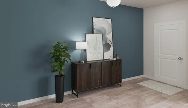 a kitchen with stainless steel appliances kitchen island granite countertop a stove a white cabinets a dining table and chairs with wooden floor