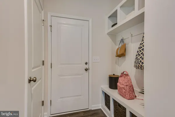 a bathroom with a granite countertop sink a mirror and a shower