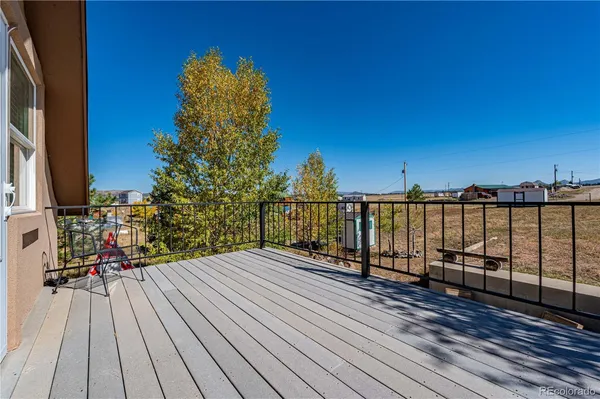 a view of a balcony with wooden floor