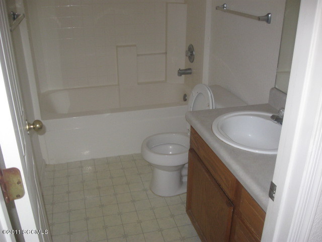 362 Annette Court Rio Rico, AZ 85648 - Photo 8 of 8 a bathroom with a toilet a sink and bathtub