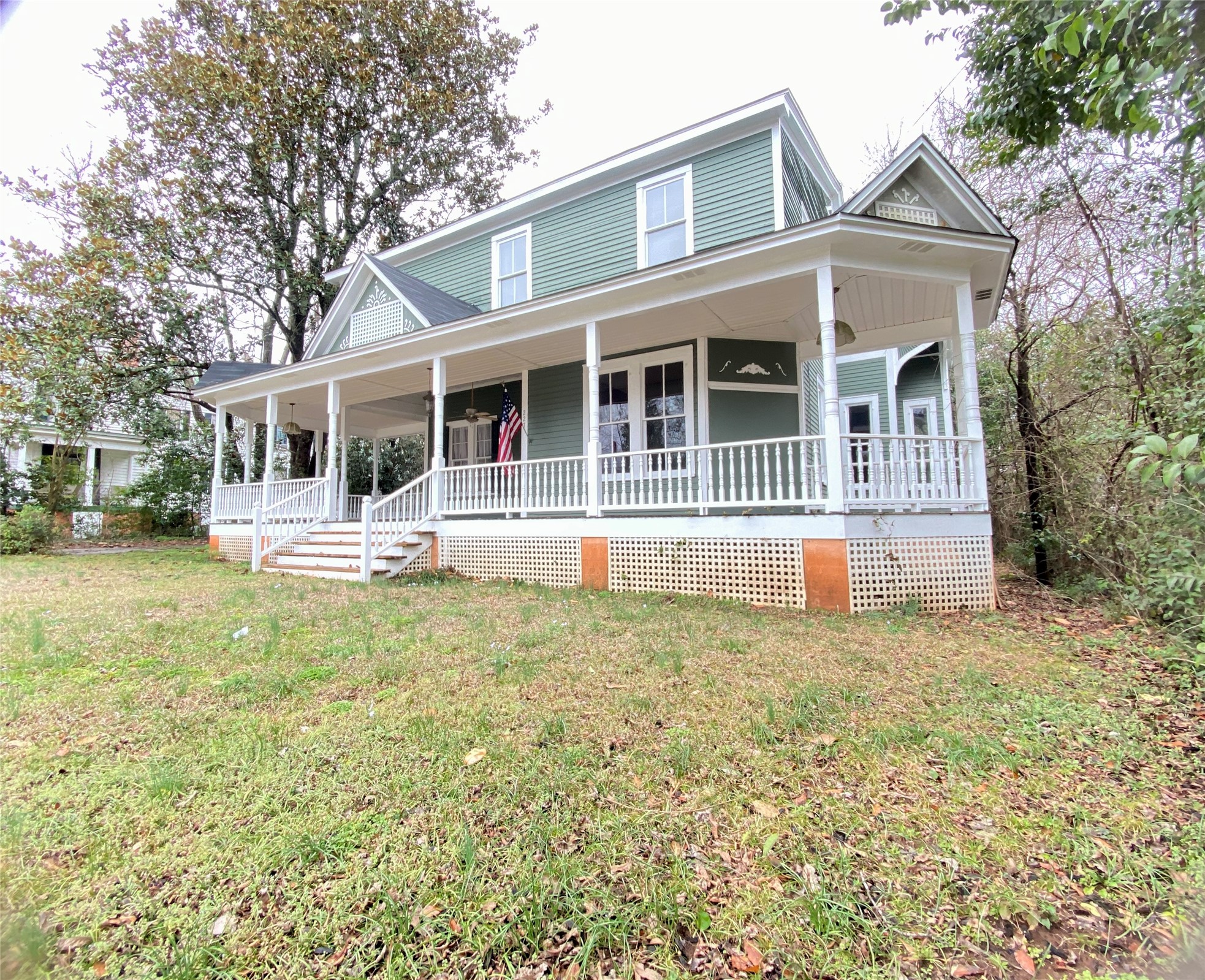 223 East Robert Toombs Avenue Washington, GA 30673 - Photo 3 of 46 front view of a house with a yard