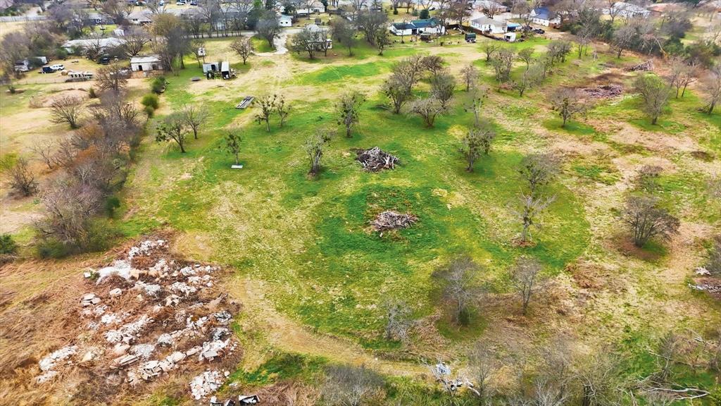 1401 South Walnut Street Cleburne, TX 76033 - Photo 11 of 23 a view of a yard with yellow plants