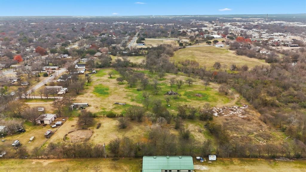 1401 South Walnut Street Cleburne, TX 76033 - Photo 17 of 23 an aerial view of residential houses with outdoor space