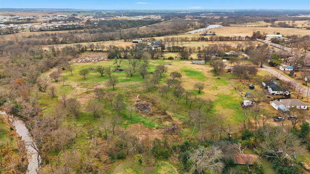 1401 South Walnut Street Cleburne, TX 76033 - Photo 7 of 23 an aerial view of residential houses with outdoor space