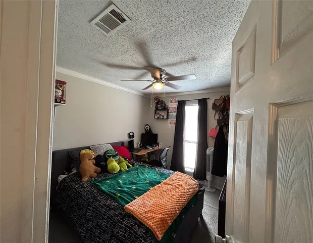 a view of a hallway to a livingroom with furniture