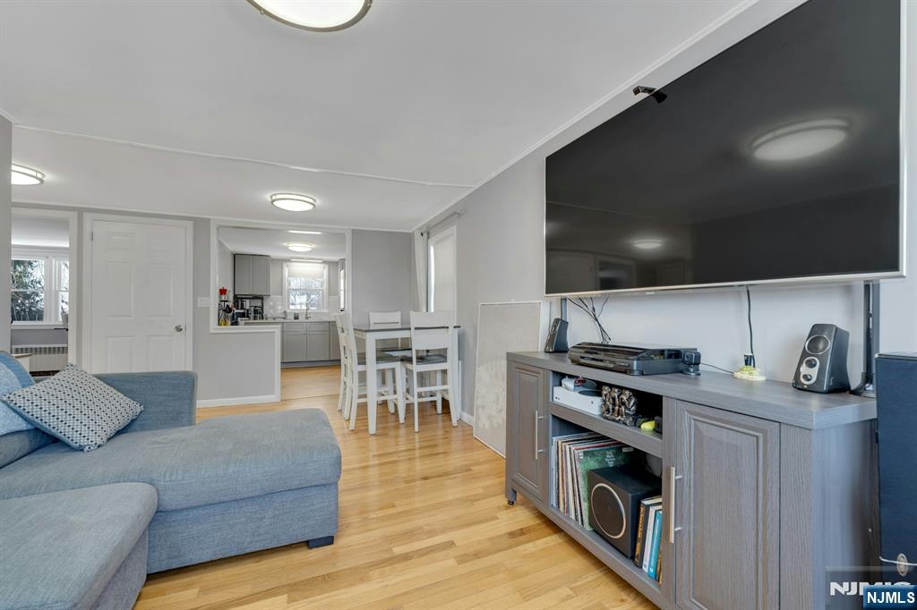 61 Christina Street, Unit 2 Little Ferry, NJ 07643 - Photo 11 of 18 a living room with furniture and a flat screen tv