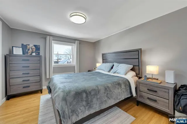 a bed room with a bed and a window