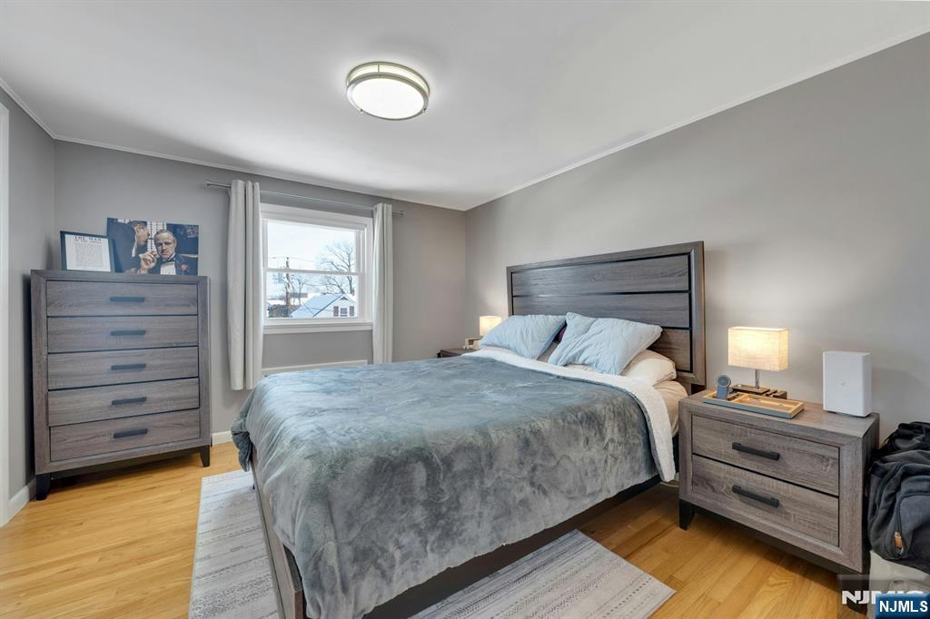 61 Christina Street, Unit 2 Little Ferry, NJ 07643 - Photo 13 of 18 a bed room with a bed and a window