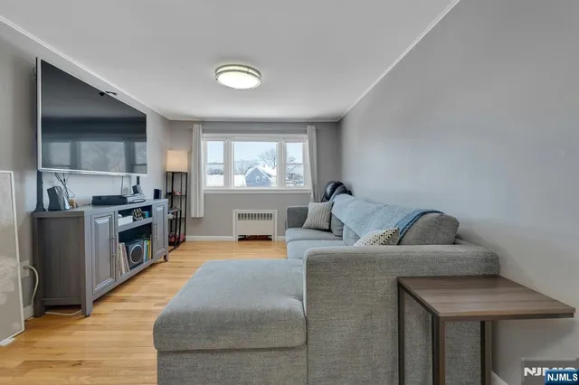 a kitchen with stainless steel appliances granite countertop a sink and a refrigerator