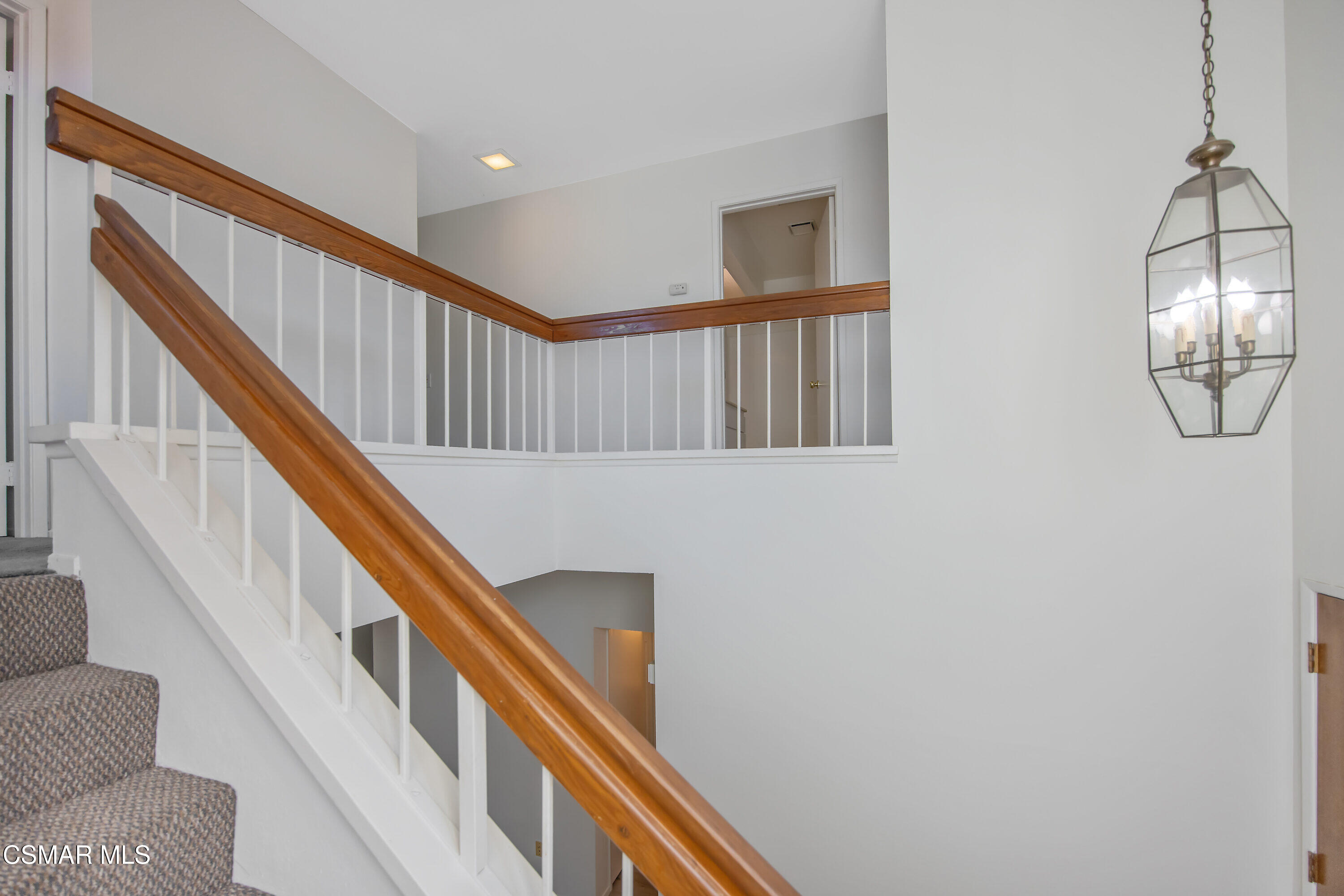 11833 Nightingale Street Moorpark, CA 93021 - Photo 18 of 46 a view of staircase with railing and white walls