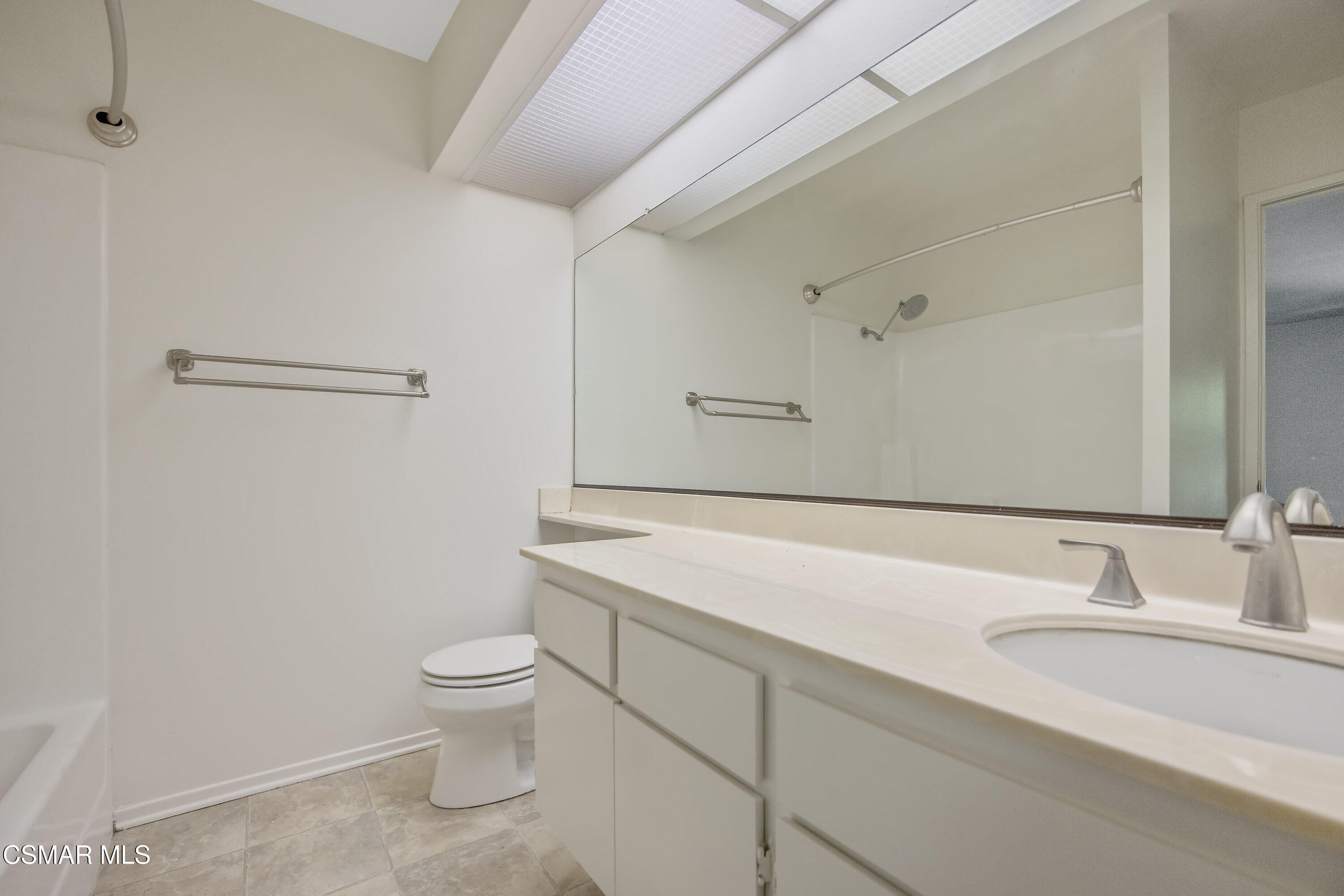 11833 Nightingale Street Moorpark, CA 93021 - Photo 26 of 46 a bathroom with a sink a toilet and a large mirror