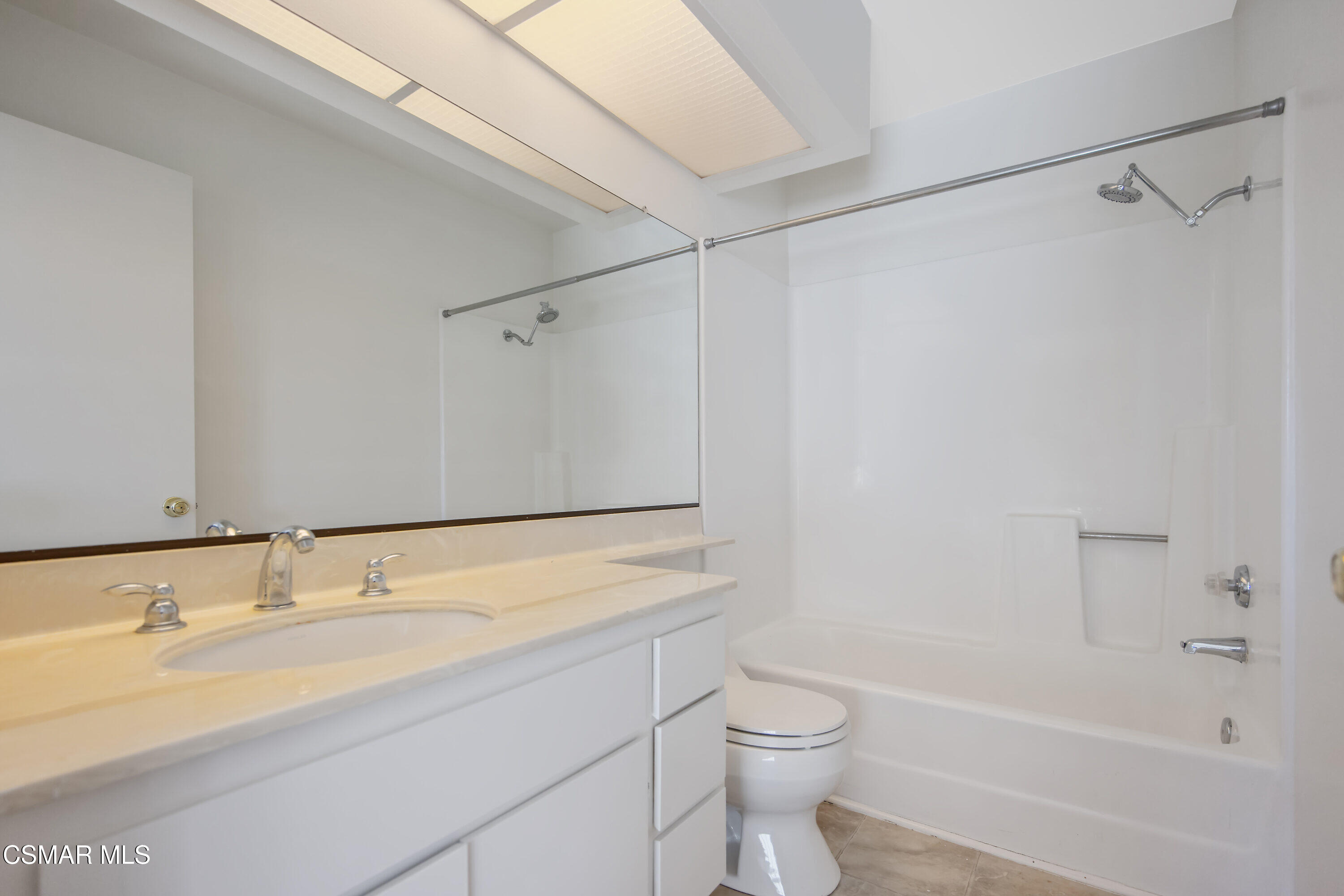 11833 Nightingale Street Moorpark, CA 93021 - Photo 28 of 46 a bathroom with a granite countertop sink toilet and shower