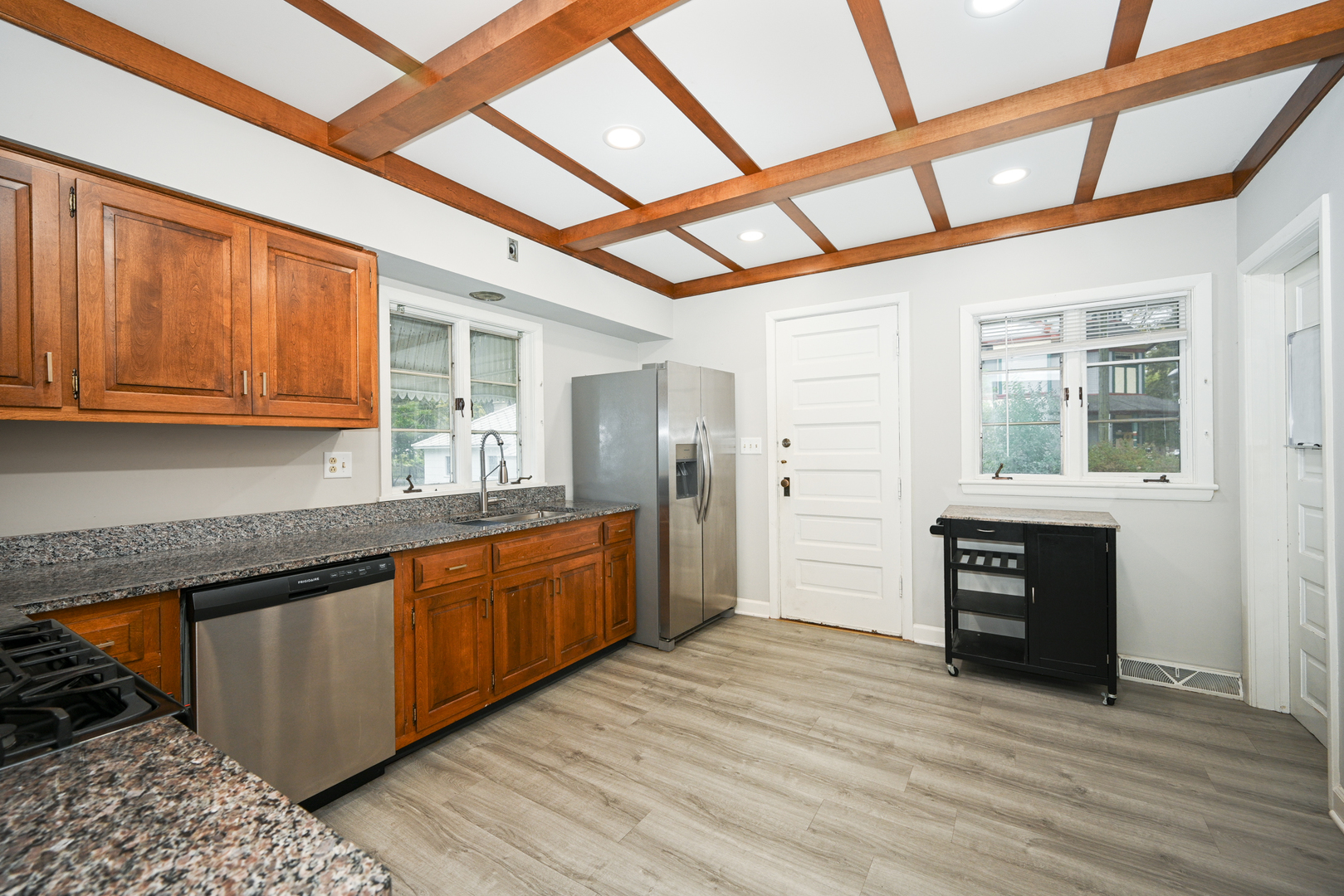 24021 Chicago Street Plainfield, IL 60544 - Photo 13 of 41 a kitchen with stainless steel appliances granite countertop a stove cabinets and wooden floor