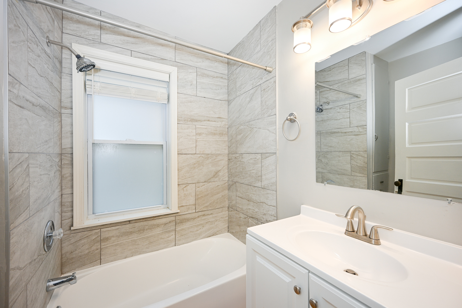 24021 Chicago Street Plainfield, IL 60544 - Photo 21 of 41 a bathroom with a sink and a bathtub