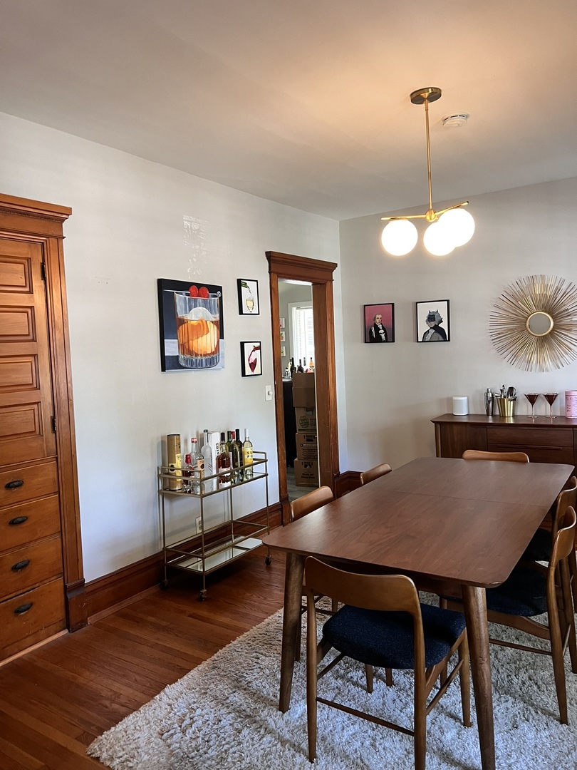 24021 Chicago Street Plainfield, IL 60544 - Photo 33 of 41 a view of a dining room with furniture and wooden floor