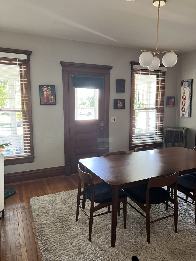 24021 Chicago Street Plainfield, IL 60544 - Photo 37 of 41 a view of a dining room with furniture window and wooden floor