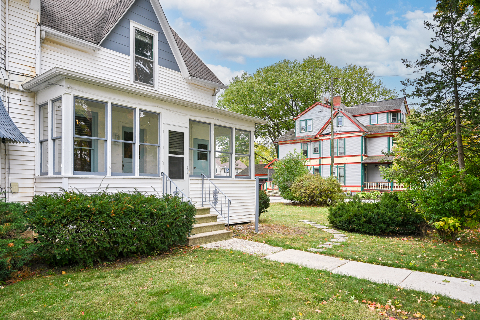 24021 Chicago Street Plainfield, IL 60544 - Photo 7 of 41 a view of a brick house with a yard plants and large tree