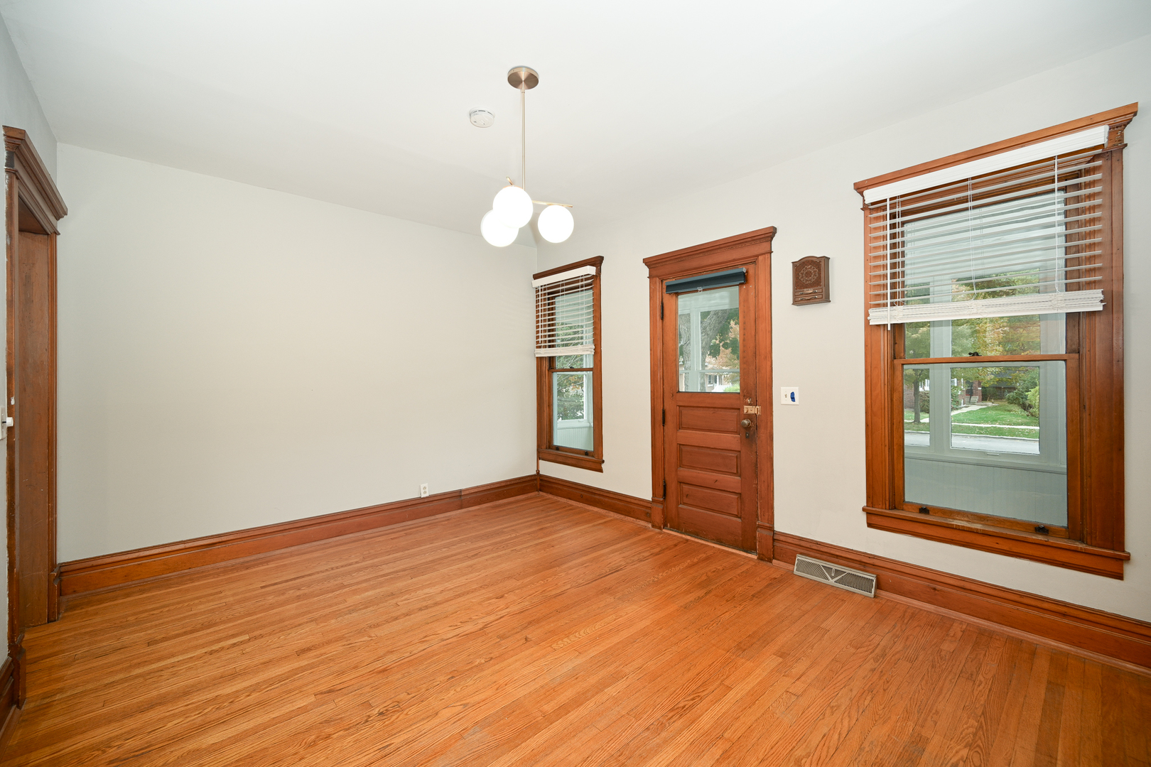24021 Chicago Street Plainfield, IL 60544 - Photo 10 of 41 a view of an empty room with wooden floor and a window