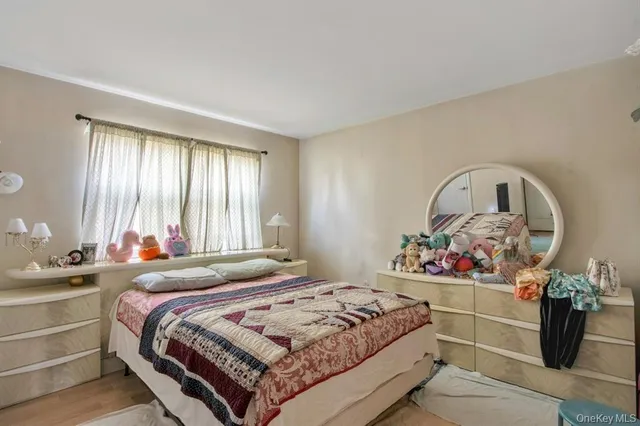 a bedroom with a bed and window