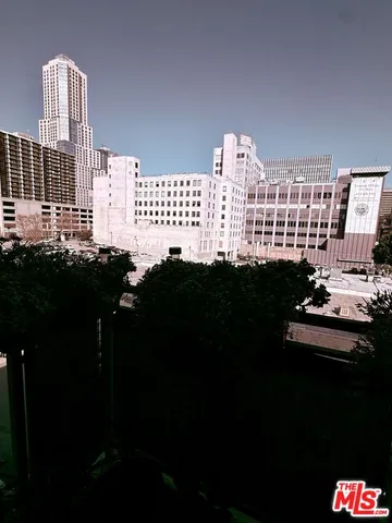 a living room with furniture and flowers