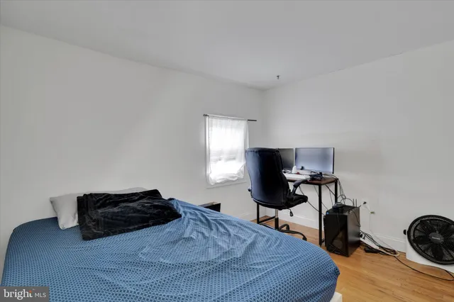 a bed room with furniture and a window