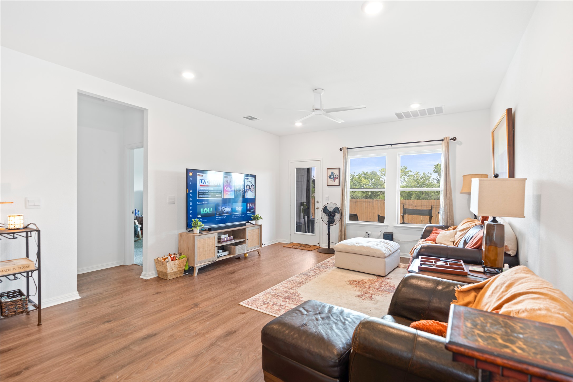 143 Santa Rosa Lane Buda, TX 78610 - Photo 12 of 28 Living room featuring light wood-style floors, recessed lighting, and ceiling fan