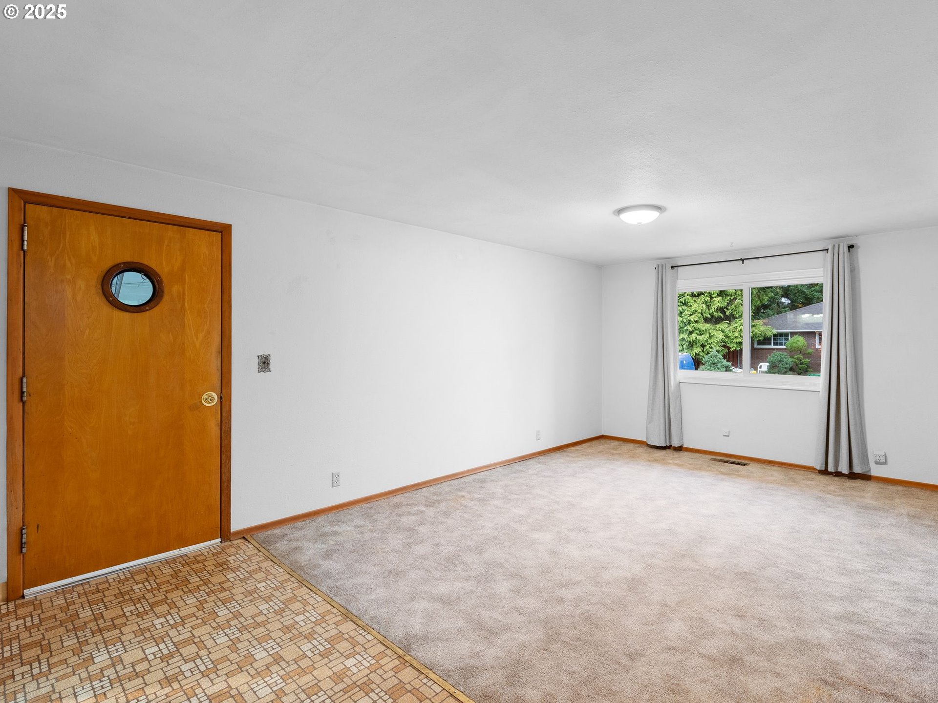 426 Northeast 116th Place Portland, OR 97220 - Photo 13 of 42 an empty room with windows