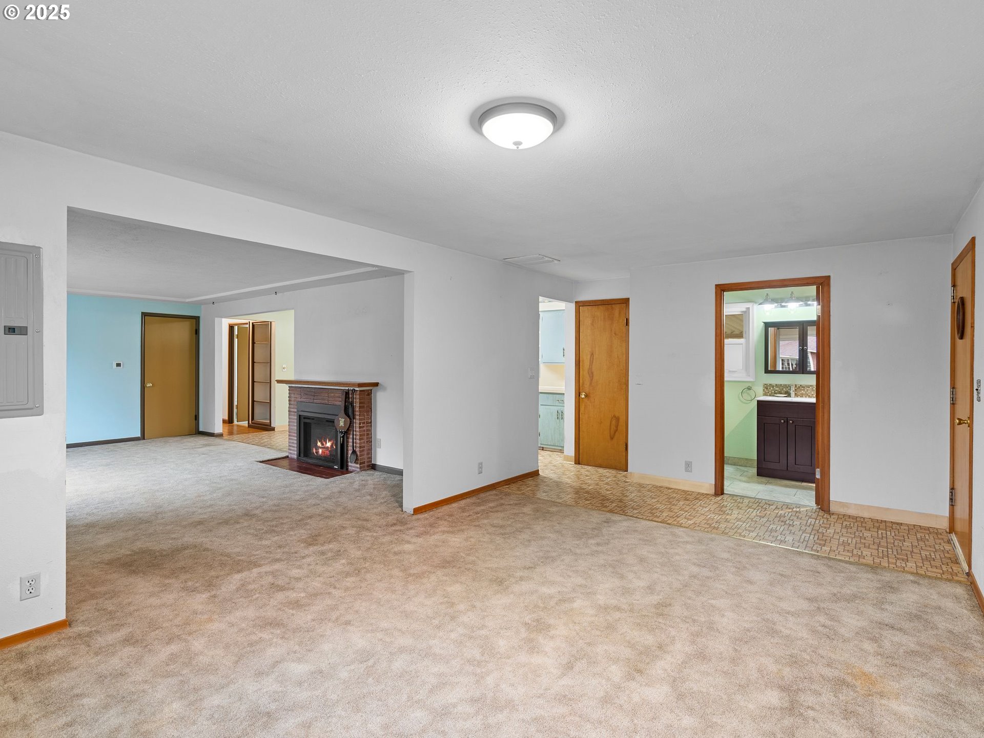 426 Northeast 116th Place Portland, OR 97220 - Photo 15 of 42 an empty room with closet and fireplace
