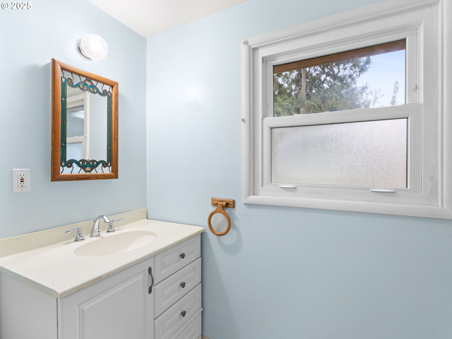 426 Northeast 116th Place Portland, OR 97220 - Photo 19 of 42 a bathroom with a sink vanity and a mirror