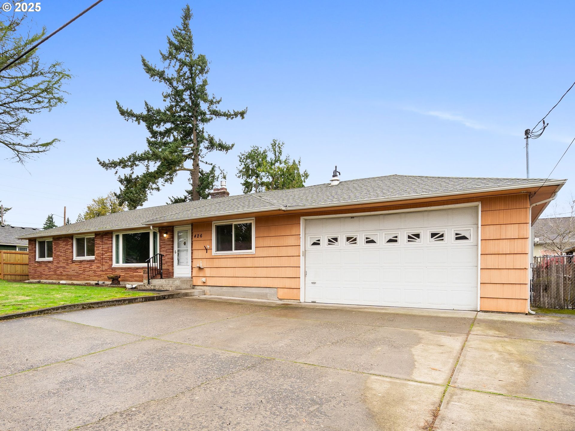 426 Northeast 116th Place Portland, OR 97220 - Photo 2 of 42 a front view of a house with garden