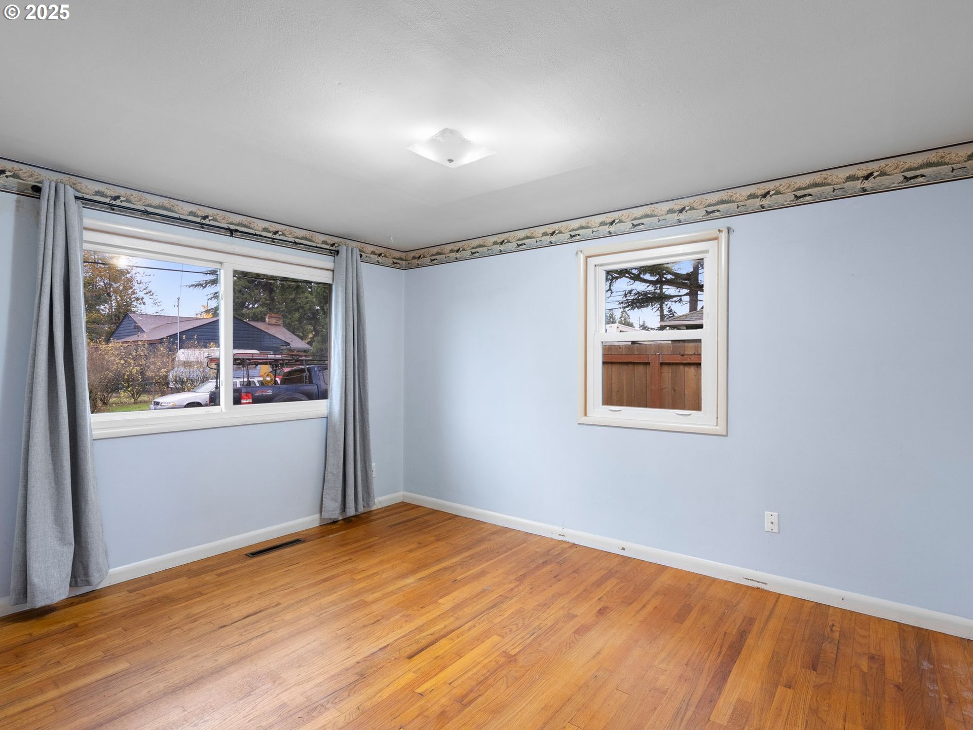 426 Northeast 116th Place Portland, OR 97220 - Photo 23 of 42 a view of empty room with wooden floor