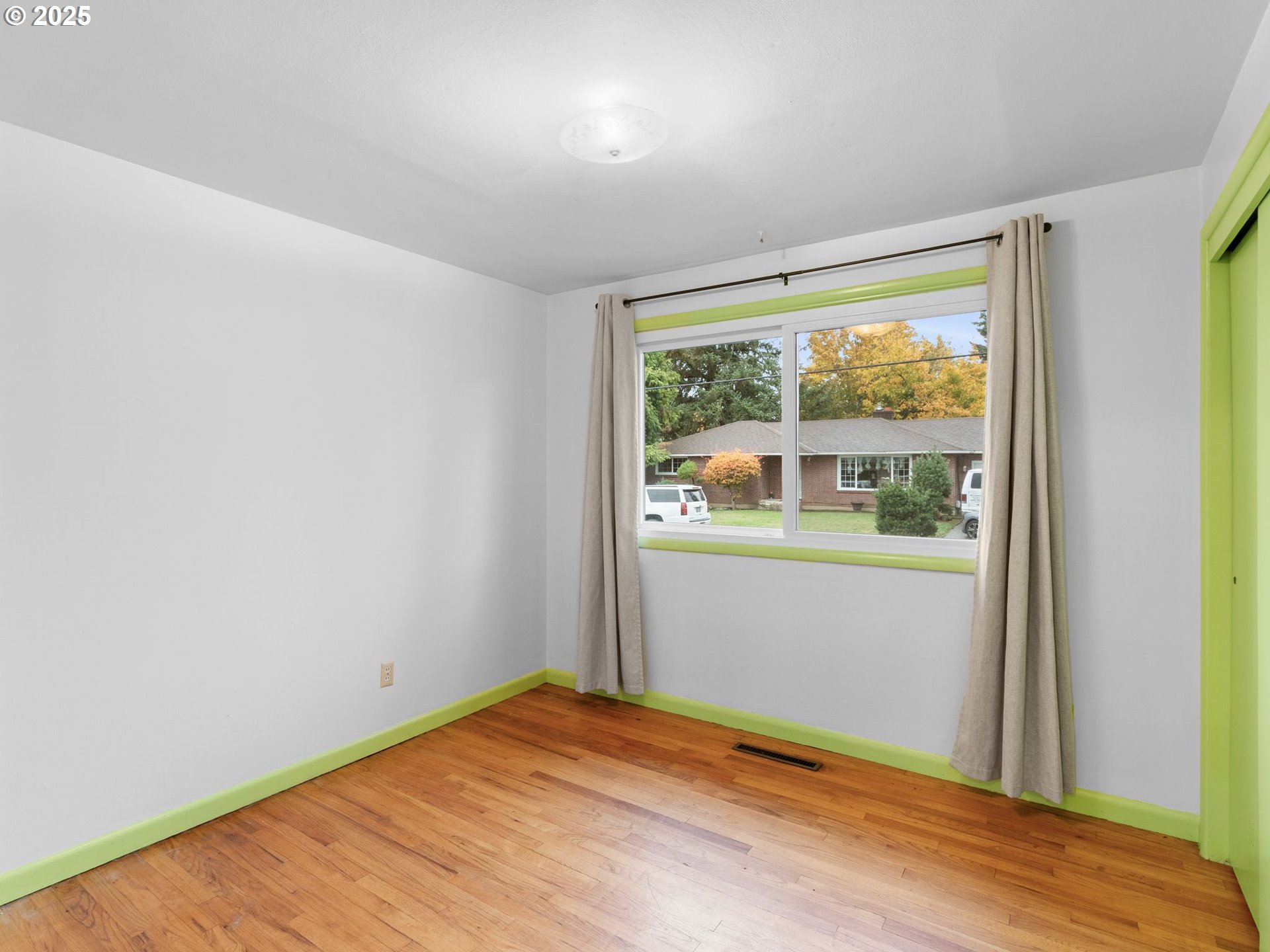 426 Northeast 116th Place Portland, OR 97220 - Photo 25 of 42 a view of empty room with wooden floor and fan