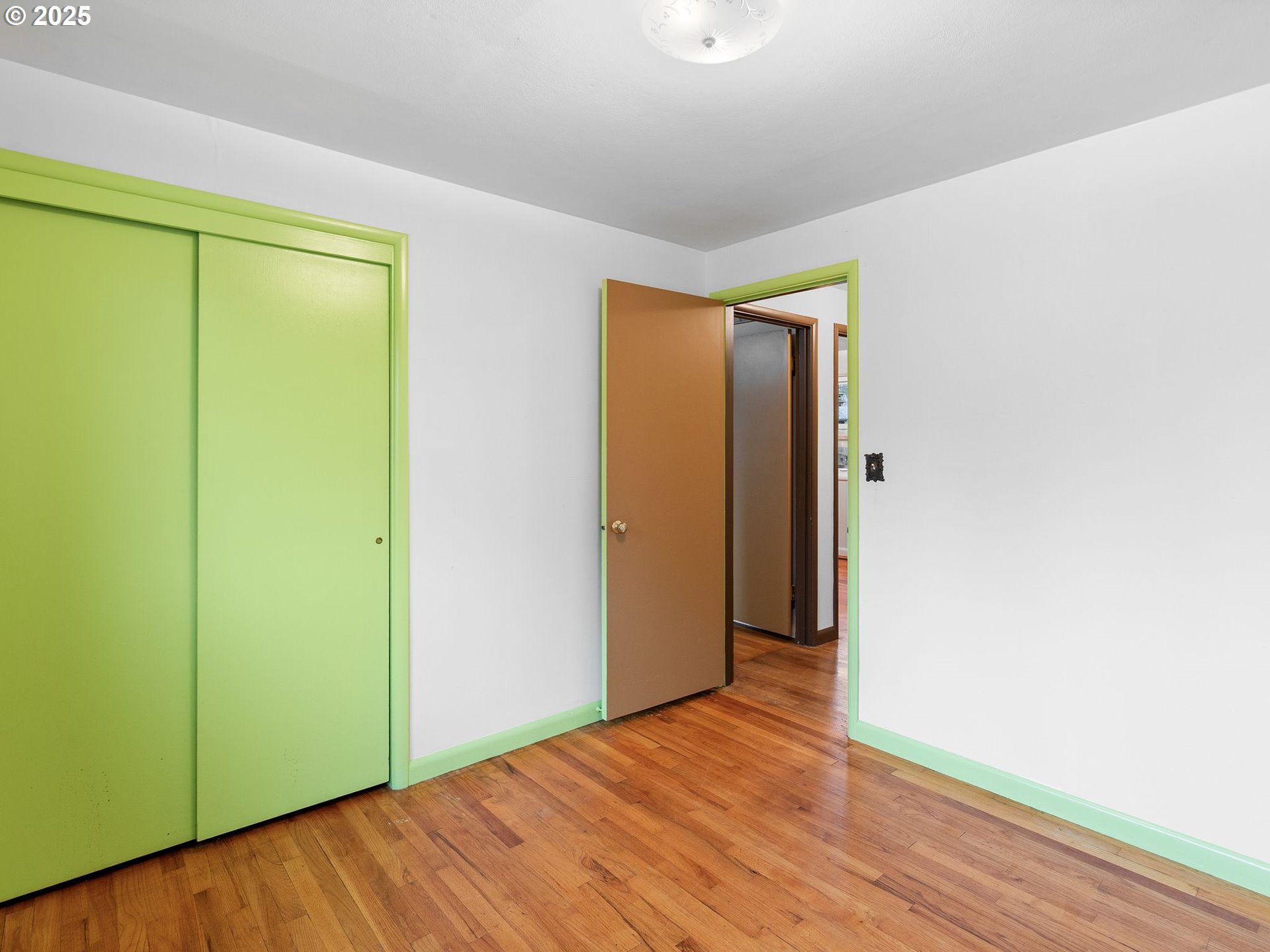 426 Northeast 116th Place Portland, OR 97220 - Photo 26 of 42 a view of an empty room with wooden floor
