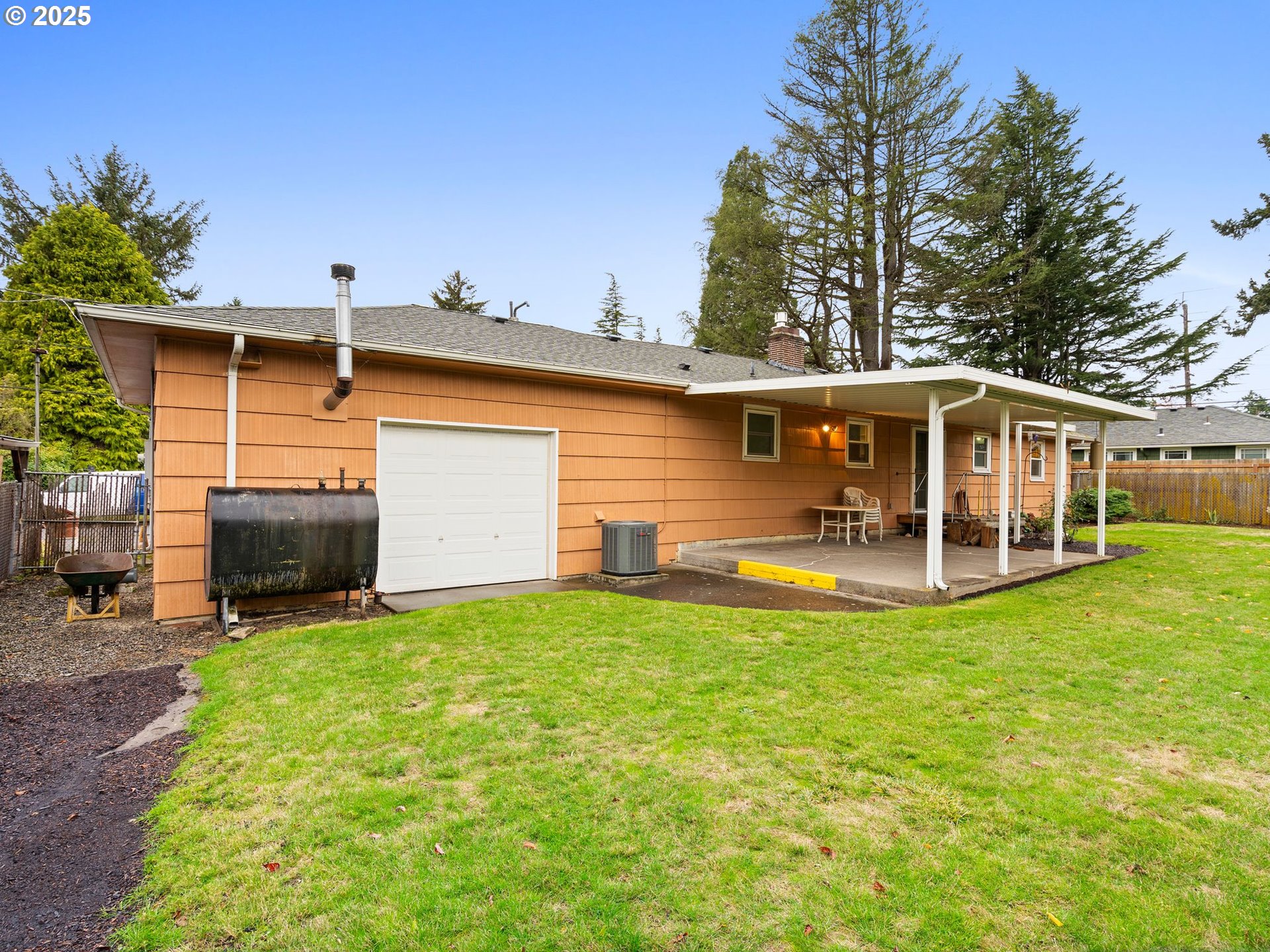426 Northeast 116th Place Portland, OR 97220 - Photo 33 of 42 a view of a house with a yard and sitting area