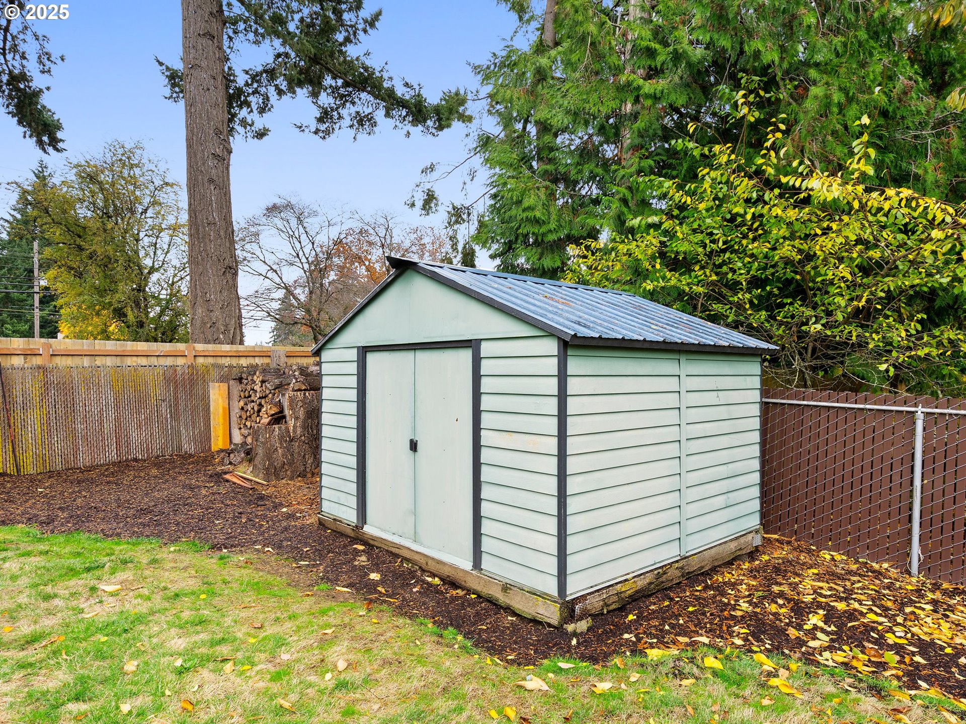 426 Northeast 116th Place Portland, OR 97220 - Photo 35 of 42 a view of a small house with a small yard and wooden fence