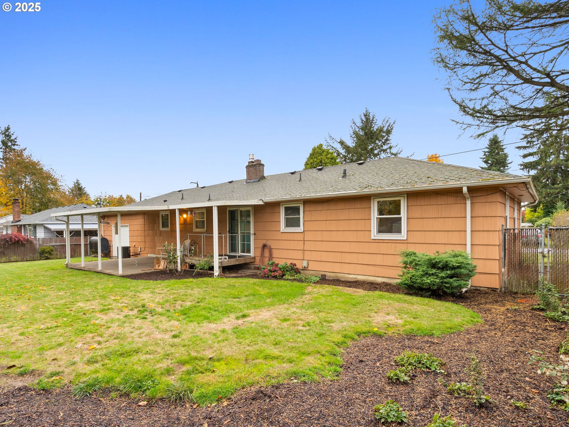 426 Northeast 116th Place Portland, OR 97220 - Photo 36 of 42 a view of a house with a yard and sitting area