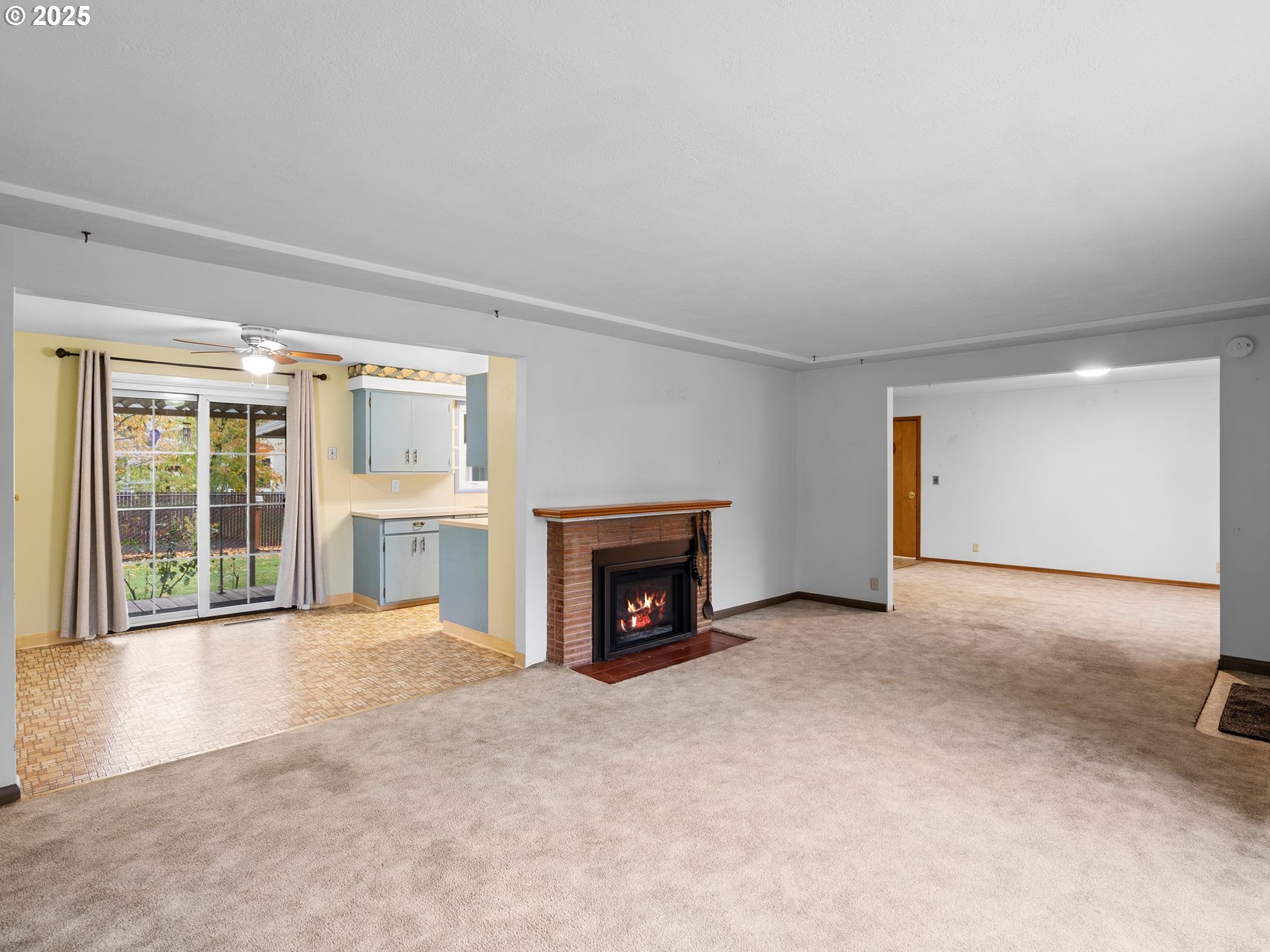 426 Northeast 116th Place Portland, OR 97220 - Photo 6 of 42 an empty room with furniture and a fireplace