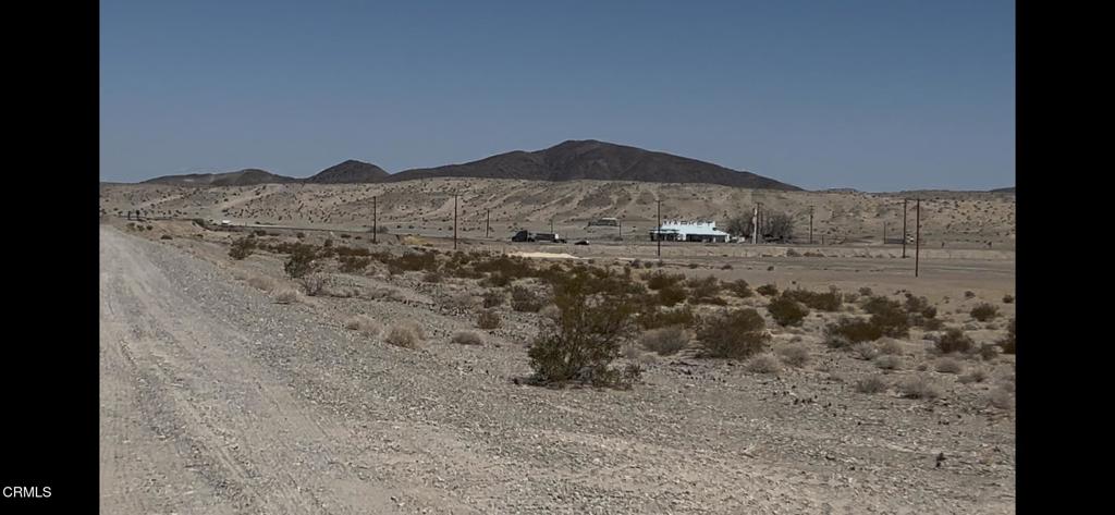 45101 Afton Road Baker, CA 92309 - Photo 17 of 39 a view of a dry field with mountains in the background