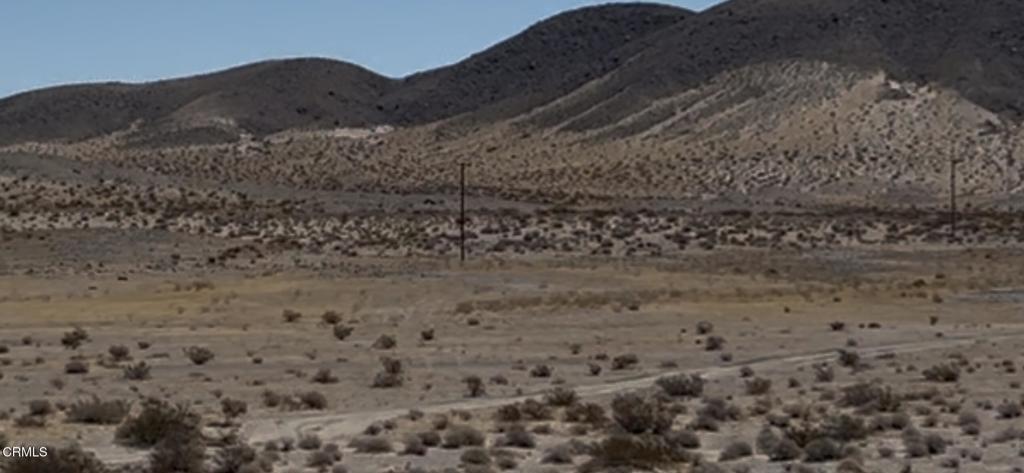 45101 Afton Road Baker, CA 92309 - Photo 25 of 38 a large stone house with a mountain in the background