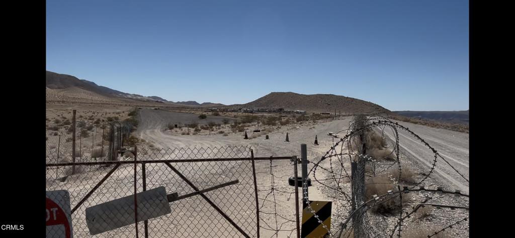 45101 Afton Road Baker, CA 92309 - Photo 29 of 38 a view of a dry yard with wooden fence