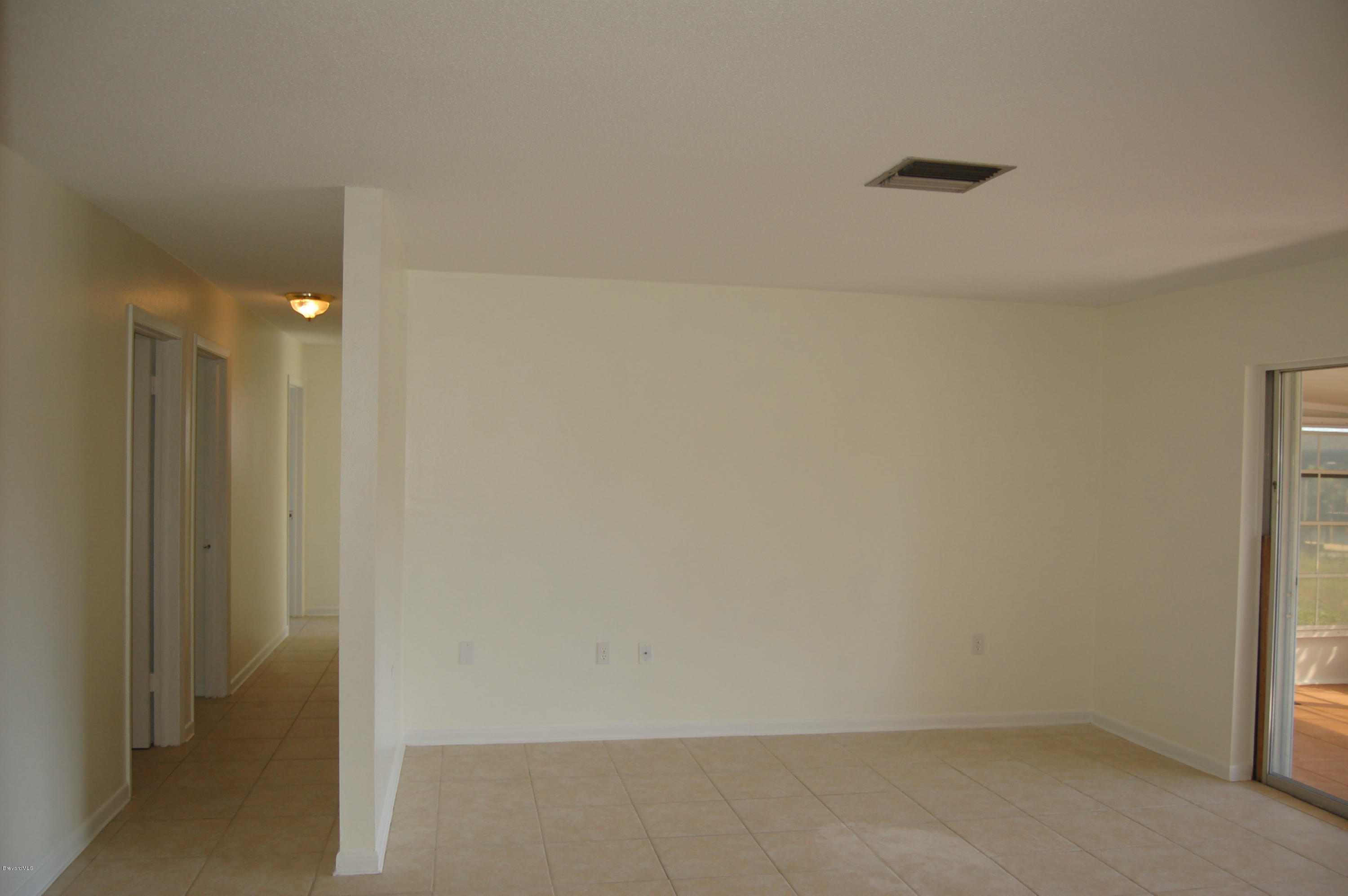 113 La Riviere Road Cocoa Beach, FL 32931 - Photo 14 of 32 Living area to Hall/Bedrooms