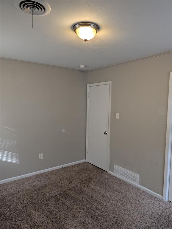 6324 Regal Road Forest Hill, TX 76119 - Photo 16 of 24 Carpeted empty room featuring baseboards
