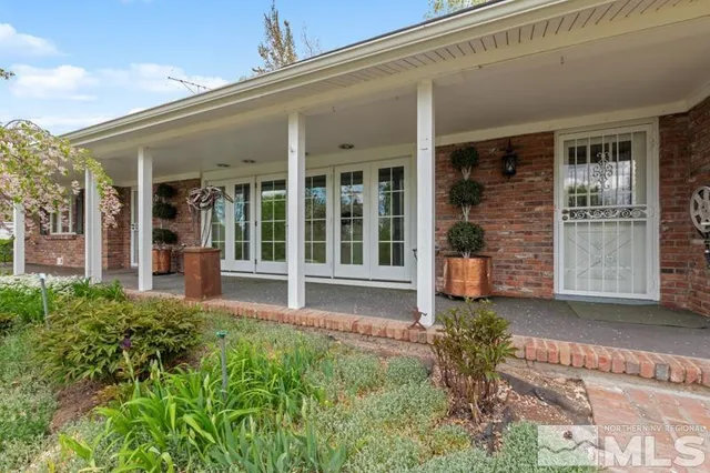 front view of a house next to a yard