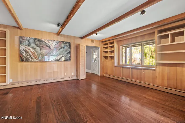 a spacious bathroom with a sink and a mirror