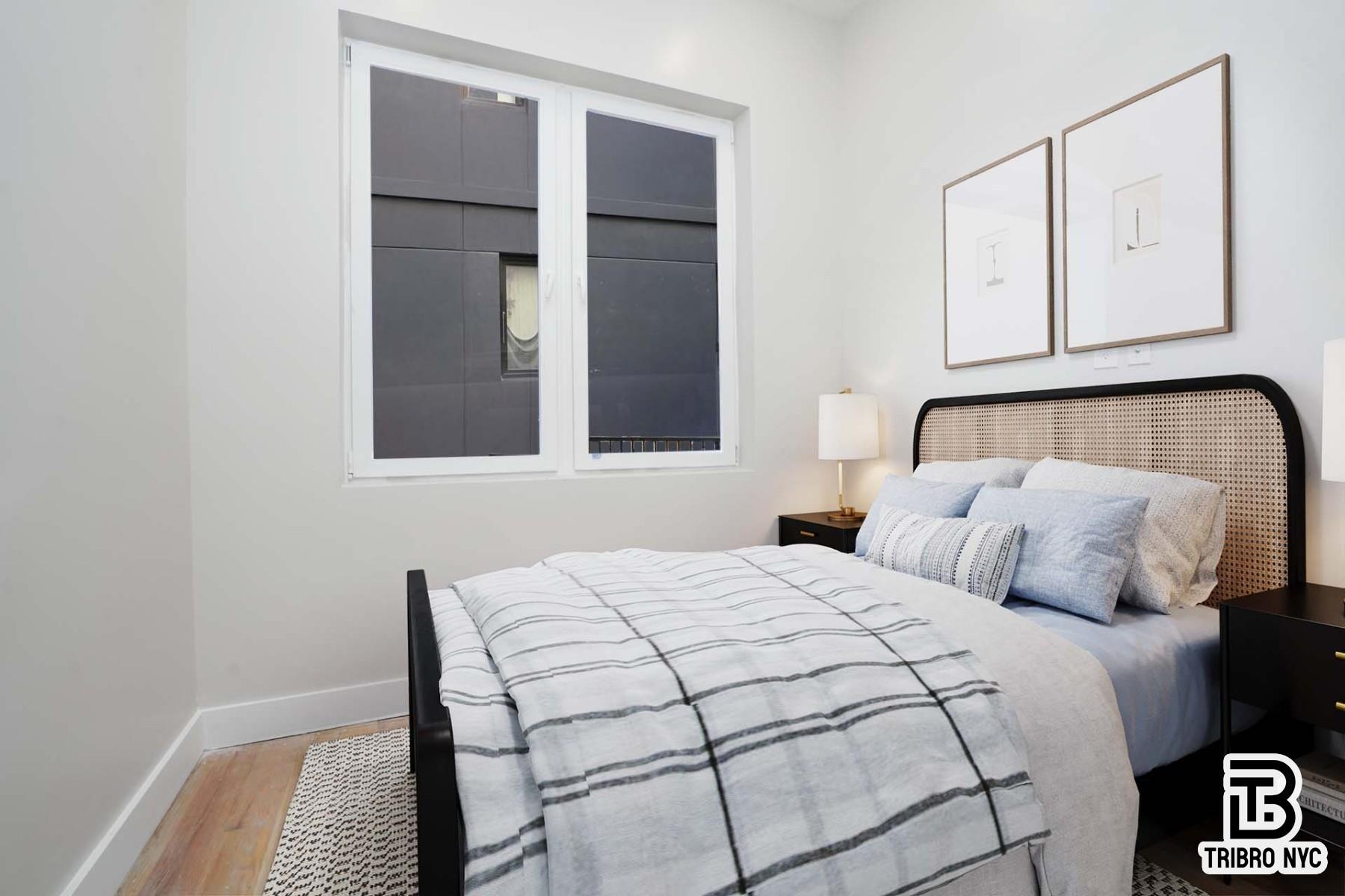 850 Flushing Avenue, Unit 1R Brooklyn, NY 11206 - Photo 4 of 10 a bedroom with a bed and cabinets