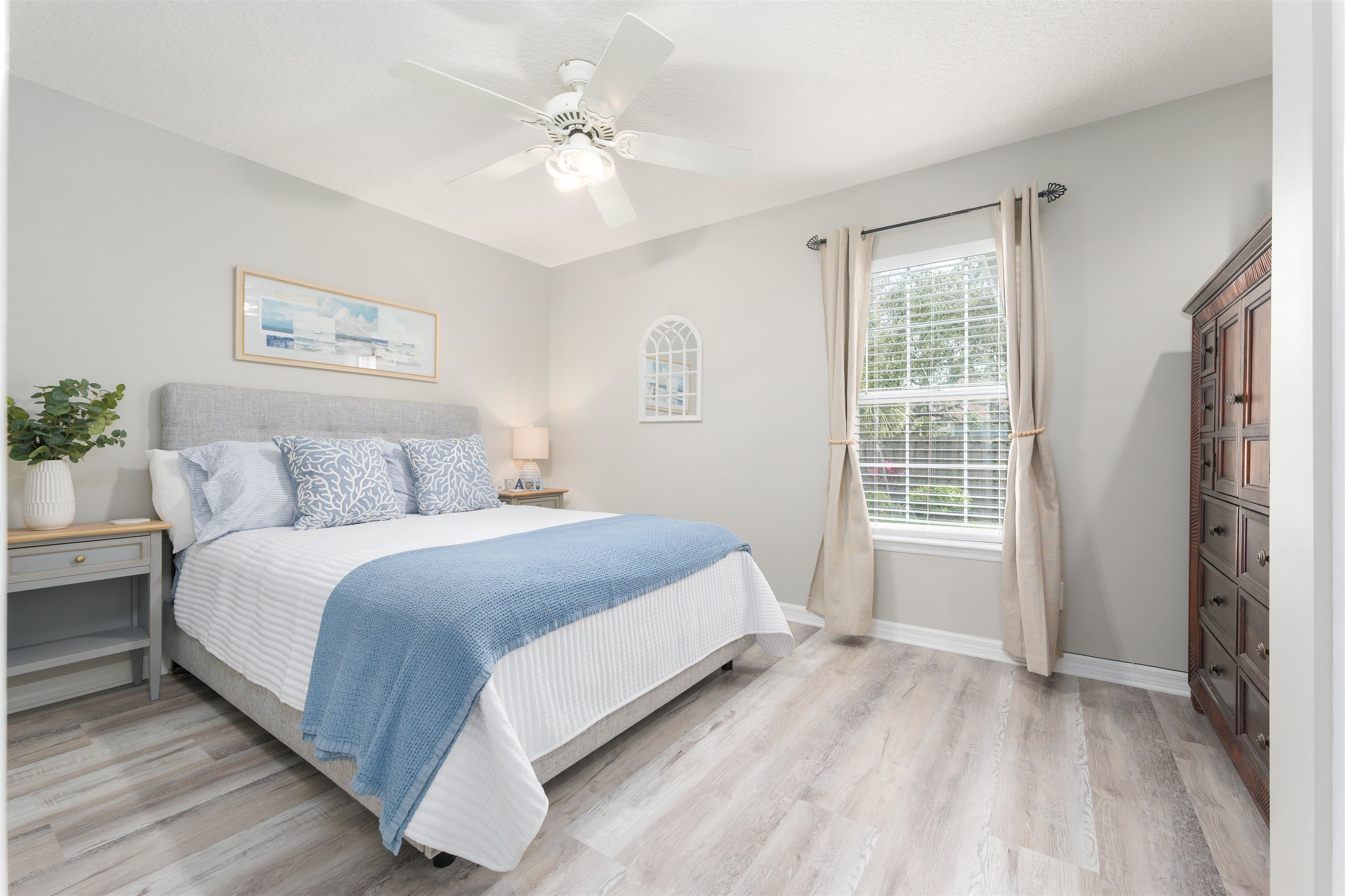5324 5th Street St. Augustine, FL 32080 - Photo 17 of 45 a bedroom with a large bed and a window