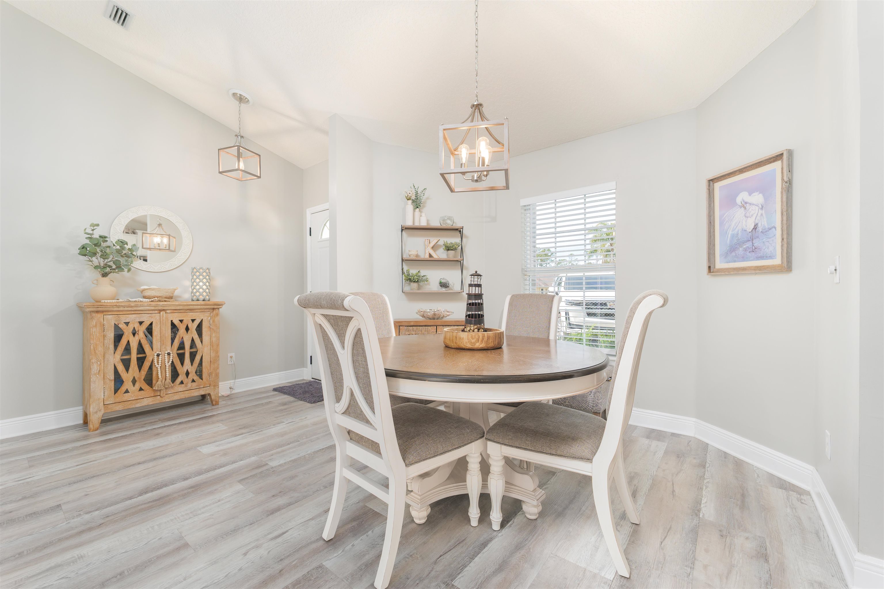 5324 5th Street St. Augustine, FL 32080 - Photo 24 of 45 a view of a dining room with furniture wooden floor and chandelier