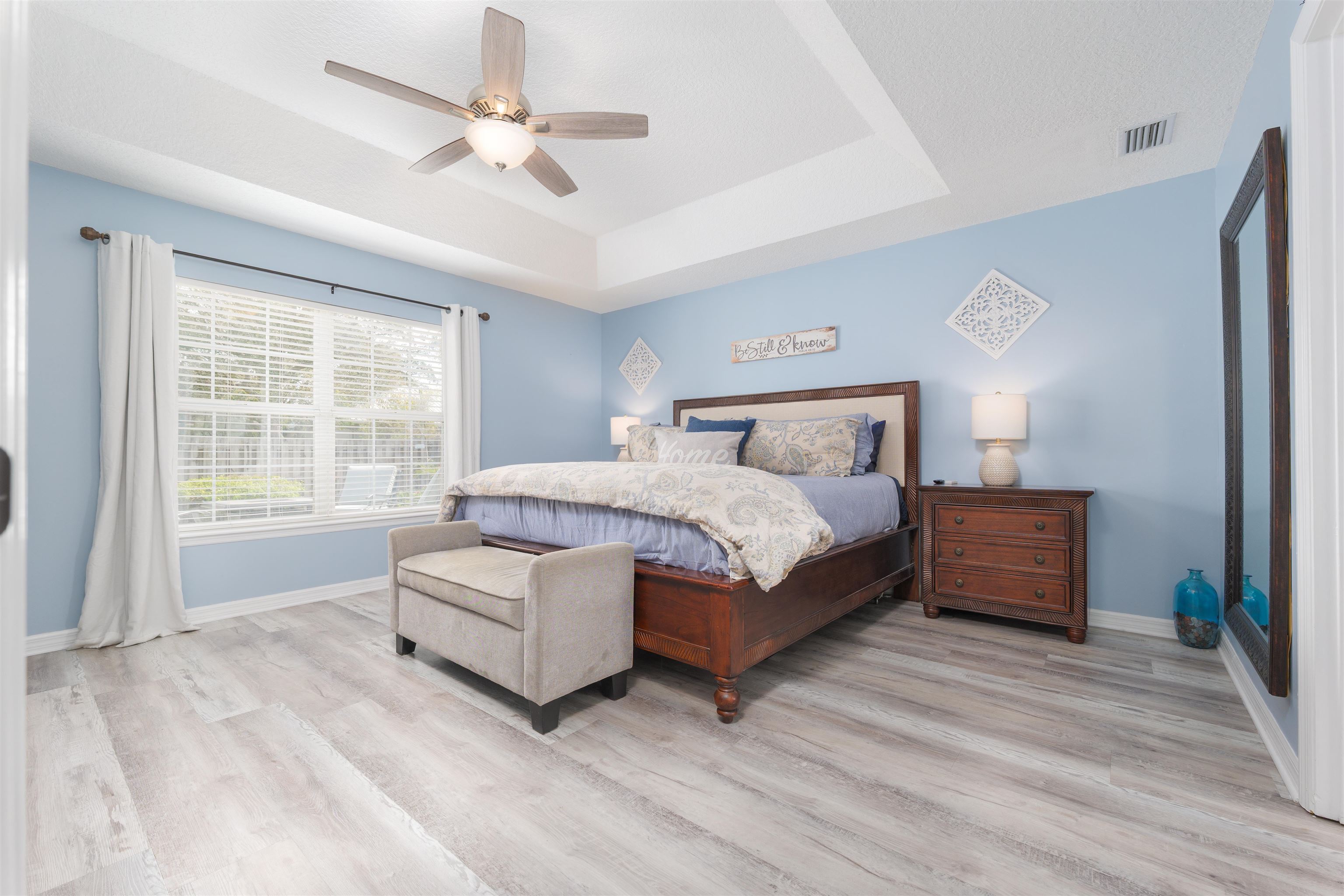 5324 5th Street St. Augustine, FL 32080 - Photo 25 of 45 a bedroom with a large bed chandelier and a window