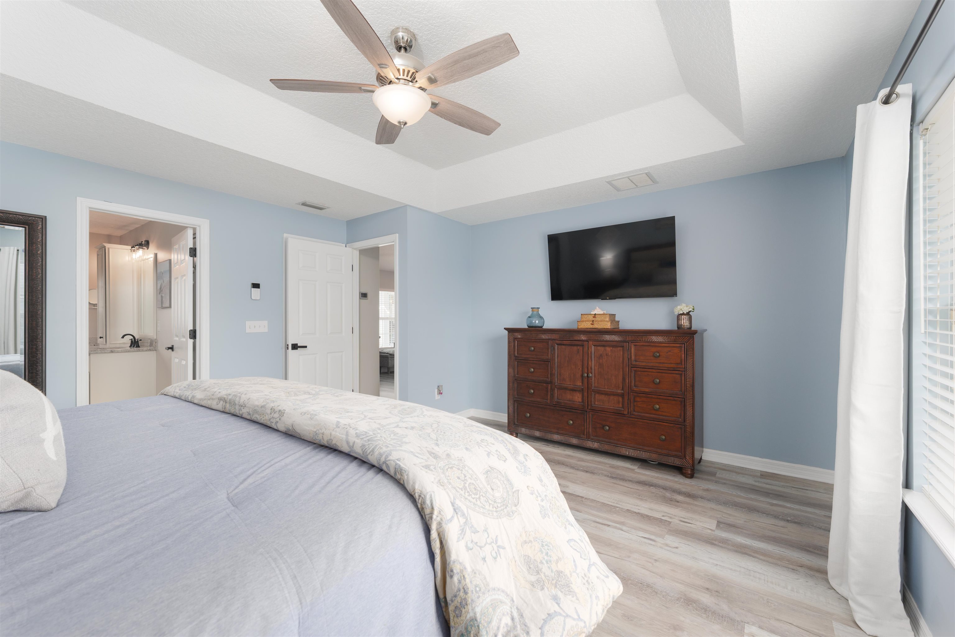 5324 5th Street St. Augustine, FL 32080 - Photo 26 of 45 a bedroom with a bed and a flat screen tv